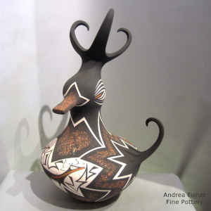 Deer, heart line and geometric design on a polychrome duck pot