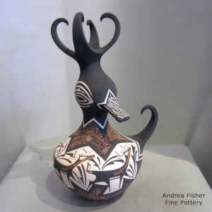 Deer, heart line and geometric design on a polychrome duck pot