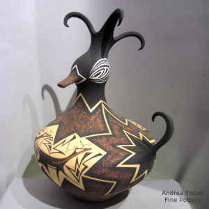 Deer, heart line and geometric design on a polychrome duck pot