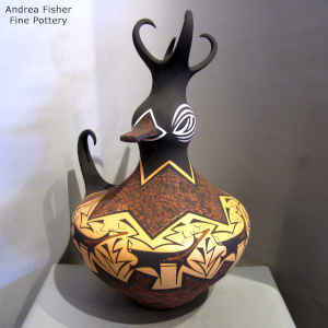 Deer, heart line and geometric design on a polychrome duck pot