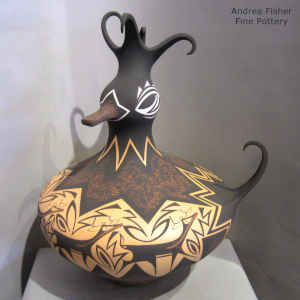 Deer, heart line and geometric design on a polychrome duck pot