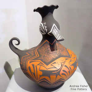 Deer, heart line and geometric design on a polychrome duck pot