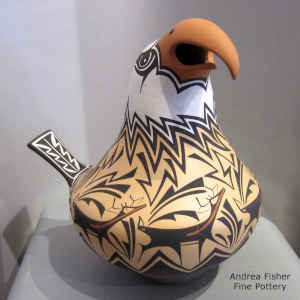 A deer-with-heart-line and geometric design on a polychrome eagle pot