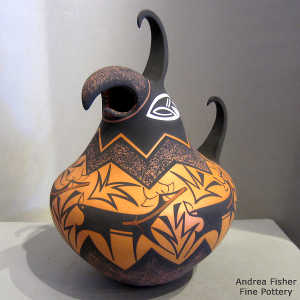 Deer, heart line and geometric design on a polychrome parrot pot