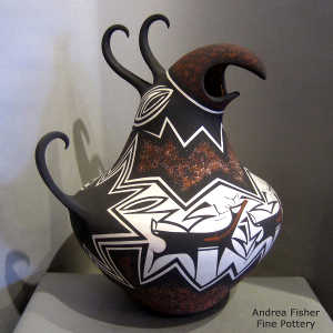 Deer, heart line and geometric design on a polychrome parrot pot