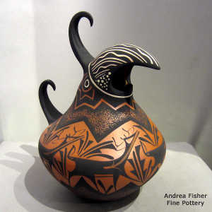 Deer, heart line and geometric design on a polychrome parrot pot