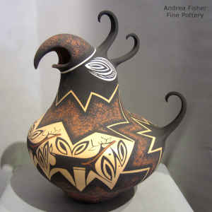 Deer, heart line and geometric design on a polychrome parrot pot