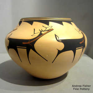 Deer, heart line and geometric design on a polychrome jar
