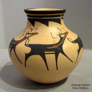 Deer, heart line and geometric design on a polychrome jar
