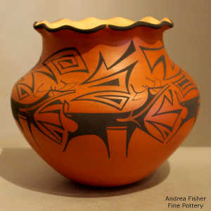 Deer, heart line and geometric design on a polychrome jar with a pie crust rim