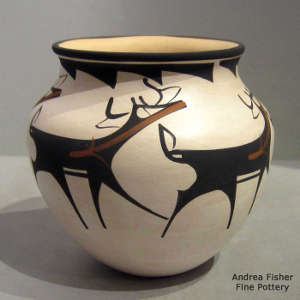 Deer, heart line and geometric design on a polychrome jar