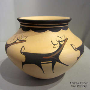 Deer, heart line and geometric design on a polychrome jar