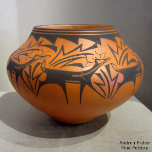 Deer, heart line and geometric design on a polychrome jar