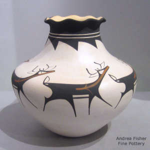 Deer, heart line and geometric design on a polychrome jar