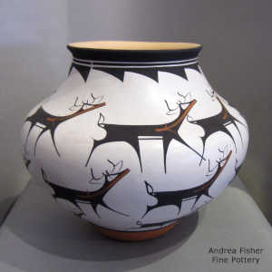Deer, heart line and geometric design on a polychrome jar