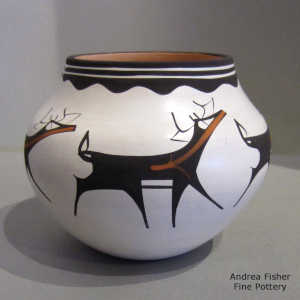 Deer, heart line and geometric design on a polychrome jar