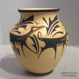 Deer, heart line and geometric design on a polychrome jar
