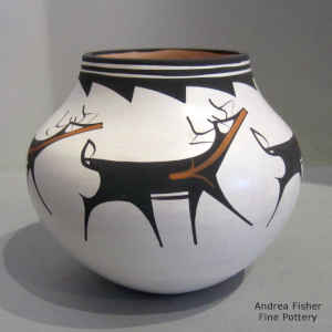 Deer, heart line and geometric design on a polychrome jar