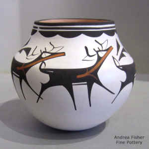 Deer, heart line and geometric design on a polychrome jar