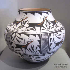 Deer, heart line, rain and geometric design on a polychrome jar