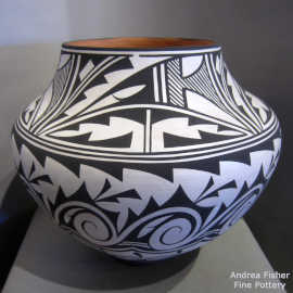 Traditional Zuni cloud, rainbird, forest, mountain and geometric design in black on a white jar
