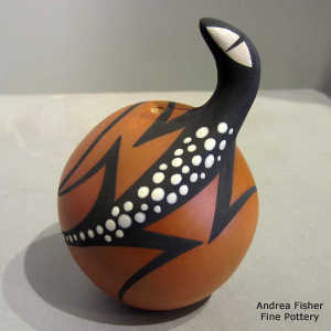 Formed lizard and geometric design on a polychrome seed pot