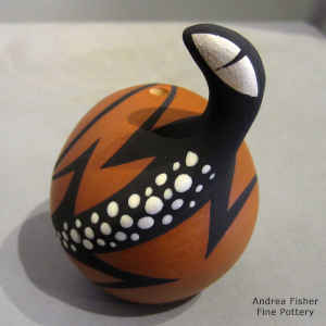 Polychrome seed pot with a lizard and geometric design