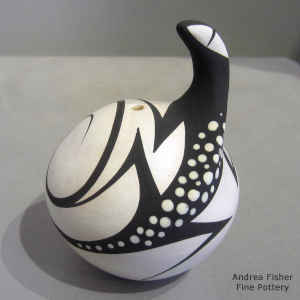 Black and white seed pot with a lizard and geometric design
