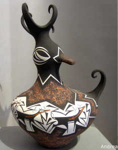 Deer, heart line and geometric design on a polychrome duck pot