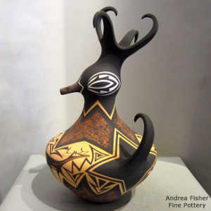 Deer, heart line and geometric design on a polychrome duck pot