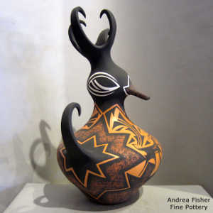 Deer, heart line and geometric design on a polychrome duck pot