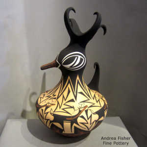 Deer, heart line and geometric design on a polychrome duck pot