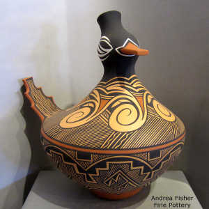Kiva step, rain, spiral and geometric design on a polychrome duck pot