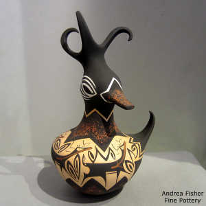 Deer, heart line and geometric design on a polychrome duck pot