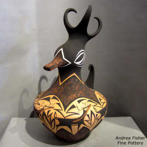 Deer, heart line and geometric design on a polychrome duck pot