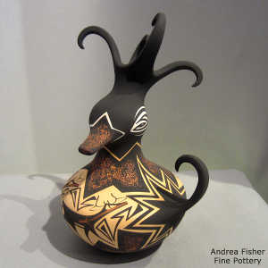 Deer, heart line and geometric design on a polychrome duck pot