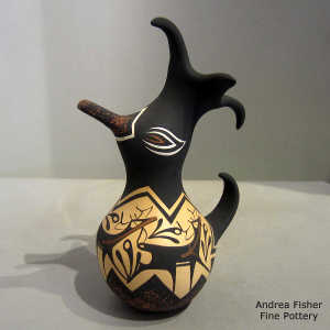 Deer, heart line and geometric design on a polychrome duck pot