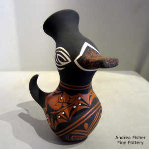 Deer, heart line and geometric design on a polychrome duck pot