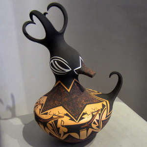 Deer, heart line and geometric design on a polychrome duck pot