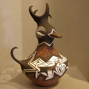 Deer, heart line and geometric design on a polychrome duck pot