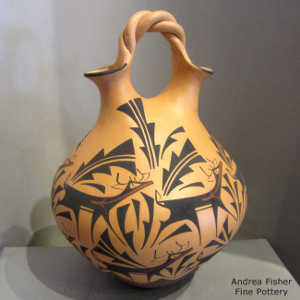 Deer, heart line and geometric design on a polychrome wedding vase