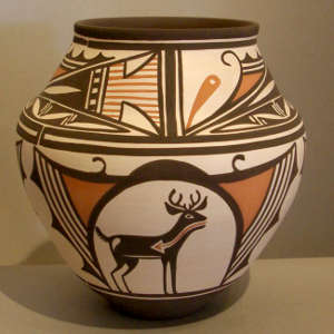 Deer in house, heartline and geometric design on a polychrome jar