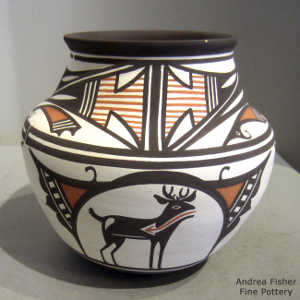 Deer-in-his-house motif and geometric design on a polychrome white-ware jar