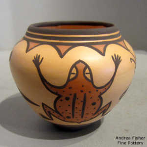 Dragonfly, frog and geometric design on a polychrome jar