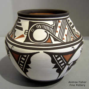 Bird element, deer-in-his-house and geometric design on a polychrome jar
