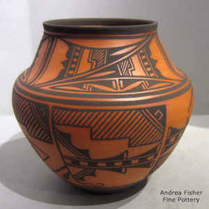 Deer, heart line and geometric design on a polychrome jar