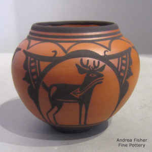 Deer-in-his-house design on a miniature black on red jar