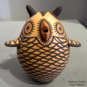 Brown owl with a black and red geometric design