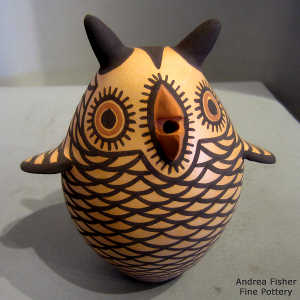 Brown owl with a black and red geometric design