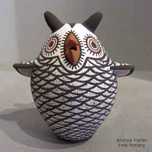White owl with a black and red geometric design